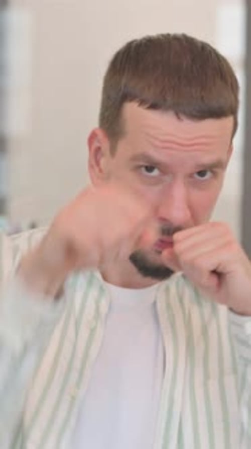 Man with Fists Up Ready To Fight or Box