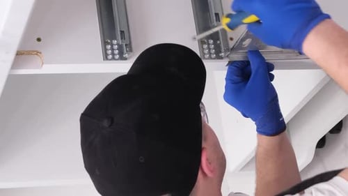 A Young Contractor for the Assembly of Kitchen Furniture Vertical Video