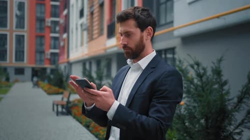 Caucasian Businessman Male Boss Entrepreneur Adult 30s Man Texting Email on Phone Work Distant Use