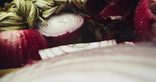 Close-up of Raw Red Onions on Wood
