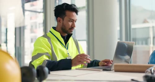 Man, laptop and contractor with typing for planning, architecture and tech for building blueprint