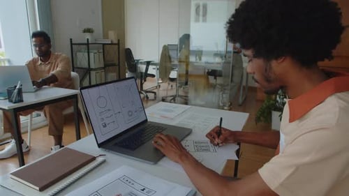 UX Designer Working on Interface of Mobile Application