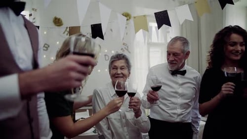 Family Celebrating Birthday Together at Home with Wine