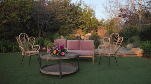 Wedding Photo Zone with Pink Couch Armchairs Round Table Bouquet Outdoors