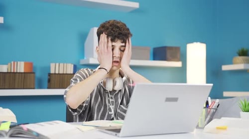 The thinking student is upset and stressed by what he remembers. Negative expression.