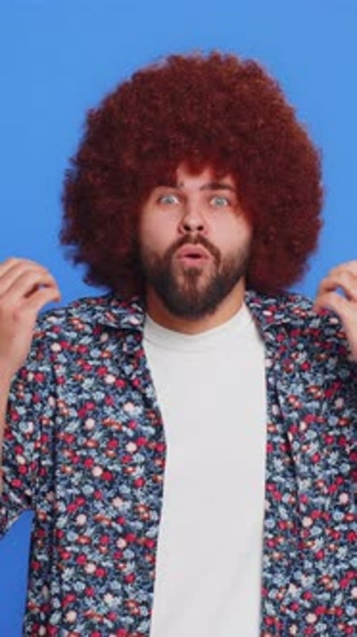Man with an Afro showing Surprised and Excited Expressions