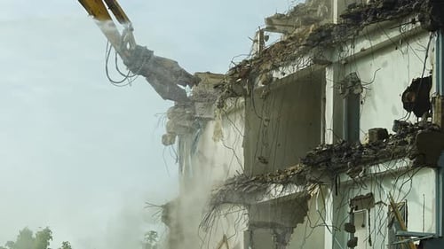 Demolition of an Old Office Building Using a Highreach Excavator Urban Redevelopment and City