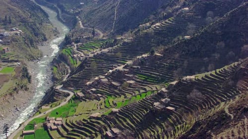A picturesque village with beautiful scenes of mountains and river aerial view, as well as charmingl