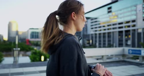 Woman Runs in Urban Setting