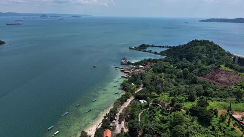 Aerial View Of A Coastal Landscape With A Mountain Sea And Boats