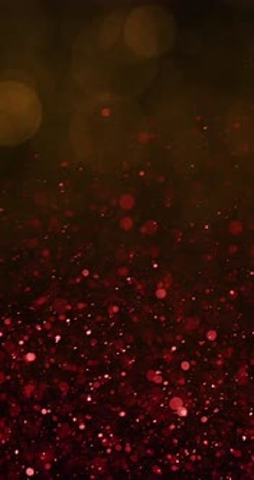 Yellow Bokeh Cascades Into Vibrant Red Particles