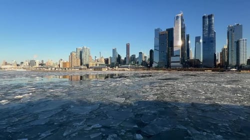 Crisp winter view of Manhattan skyline across frozen Hudson River, New York, USA
