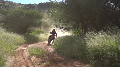 Dirt bikers racing around a corner