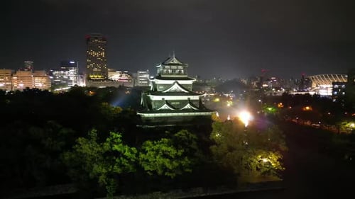 Aerial video of the Hiroshima skyline with Hiroshima Castle in Japan