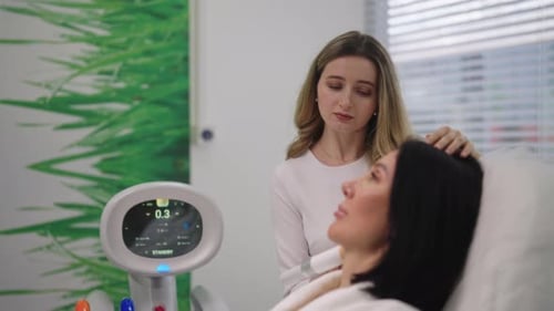 Woman Receiving Facial Treatment in Beauty Clinic