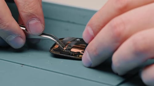smart watch being repaired by an engineer Workshop for the repair of phones and equipment