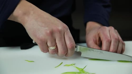 Close Up Cutting Scallions on Cutting Board