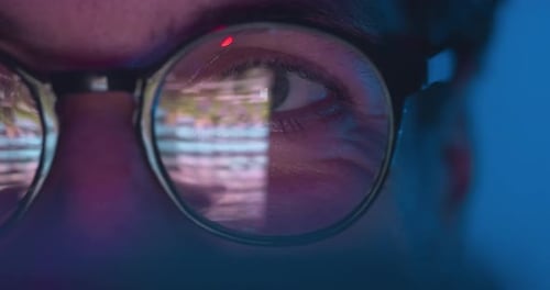 Closeup Of Eye Reflecting Digital Screen And Data Information