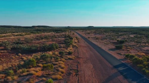 A long stretch of highway road in the outback of Australia.