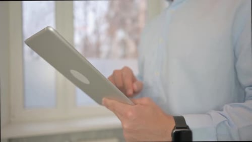 Close up of Man Using Tablet