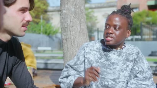 African-American College Girl Talking with Friends Outdoors on Campus