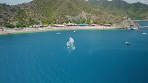 Aerial view of Active Beach, Speedboats, and Touristic Towers – Playa Blanca, Santa Marta