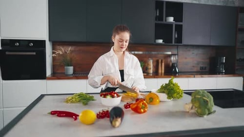 Young Woman Prepares Healthy Meal in Modern Kitchen