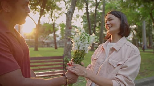 Couple Having Romantic Date in Park at Sunset