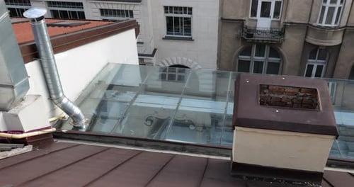 Architecture of an old European city. Shooting tiled roofs and chimneys.