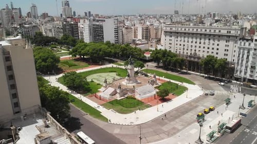 Daytime aerial view showing the architectural dome of a building and the surrounding park.