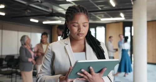Businesswoman, typing or research in office with tablet for marketing campaign