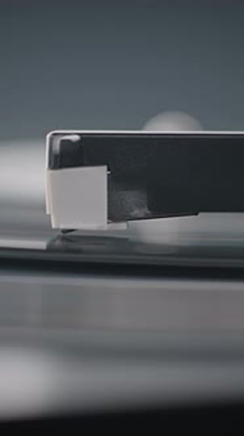 Needle Gently Scratching Grooves Playing Classic Music or Analog Sound On Vintage Turntable