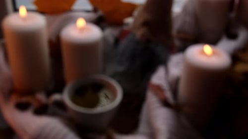 Blurred Still Life with Candles and Cup