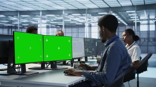 Man Safeguarding Data Center Against Hackers with Isolated Screen Computer