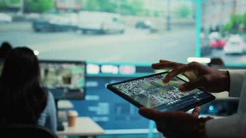 Person Using Tablet to View City Maps