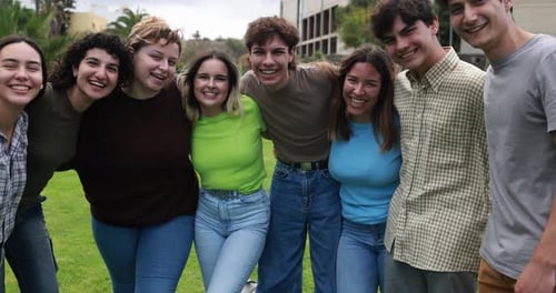 Youthful friends embrace fun and friendship on a sunny summer day at university