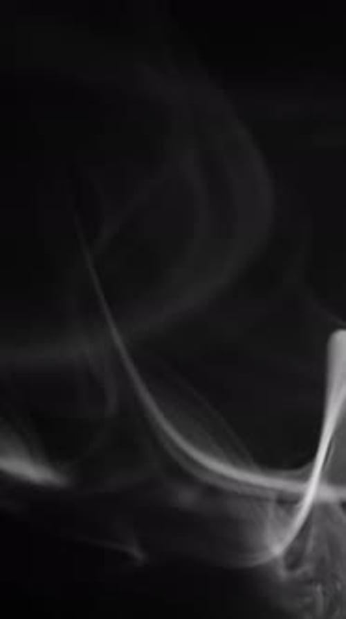 Abstract White Smoke Plumes on Black Background