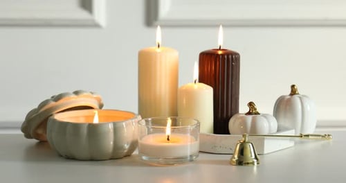 Burning Candles with Small Pumpkins for Decoration at Home