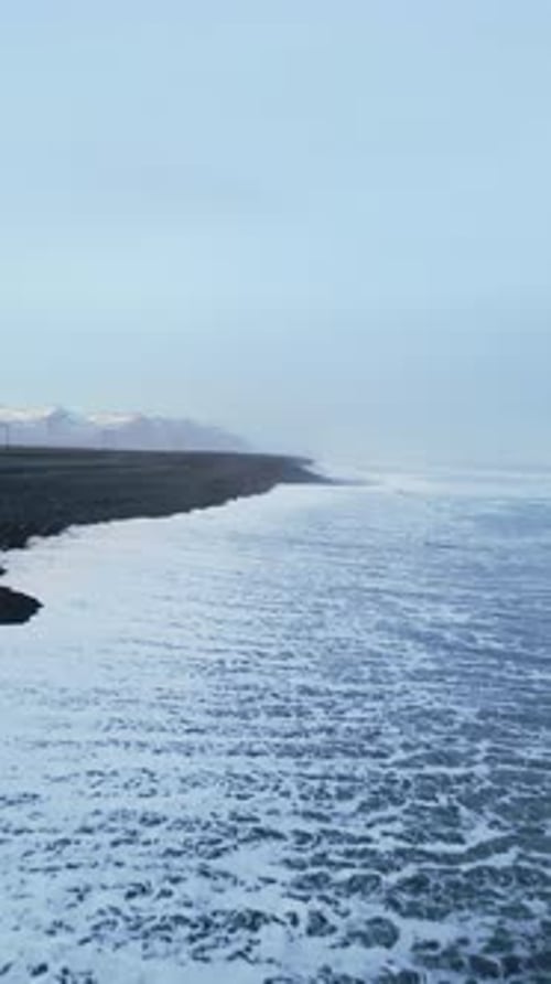 Vertical Video Aerial View of Arctic Black Sand Beach