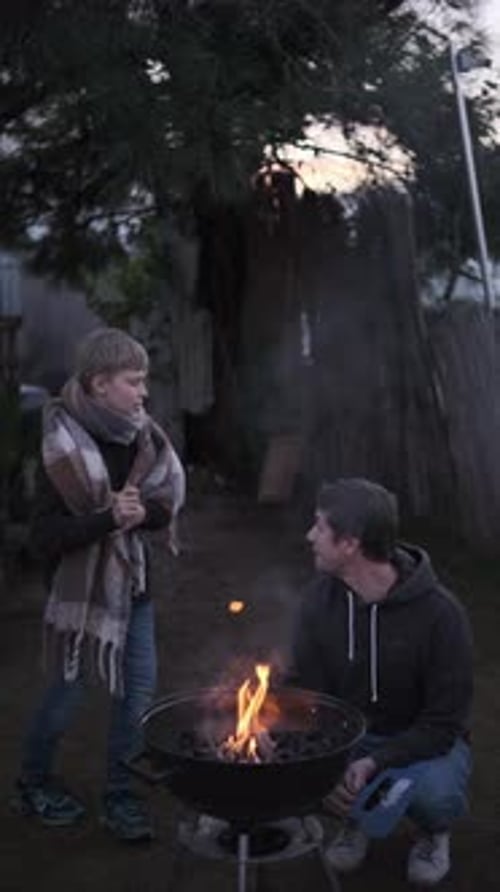 Single Father and His Son Barbecue Grill Outdoors in Family Backyard Part of Series