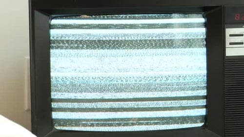 Old TV screen static in bright living room