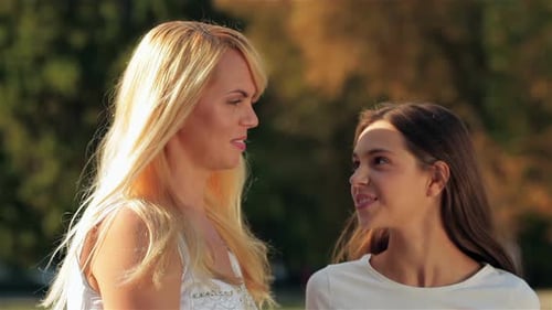 Women Bonding, Smiling, Laughing in Park on Sunny Day