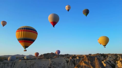 Hot Air Balloons Floating Over Cappadocia Landscape
