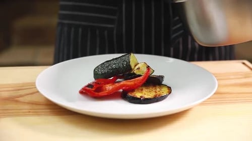 chef prepares grilled vegetables