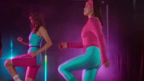 Women in Retro Leotards Doing Step Aerobics