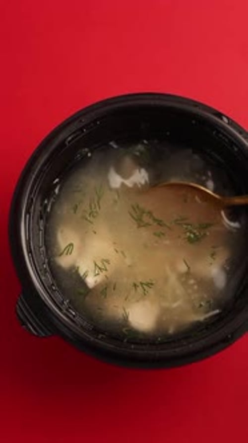 Delivery of broth with noodles and chicken meat