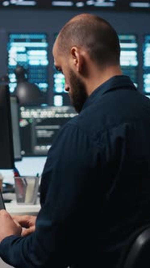 Vertical Video Computer Scientist Using Laptop Device to Do Programming in Data Center