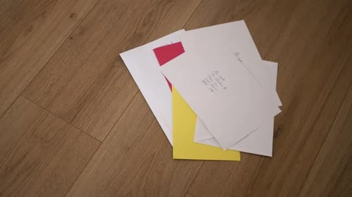 Letters Scattered on a Hardwood Floor