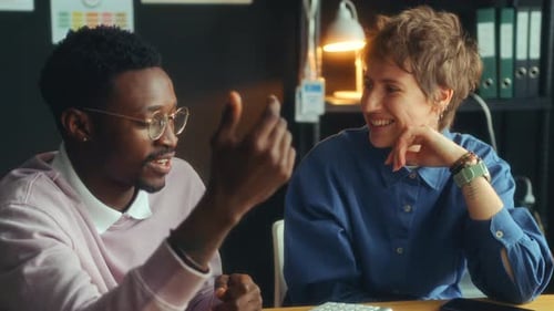 Two Diverse Coworkers Having Conversation during Office Day