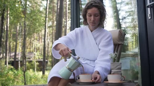 Woman Drinking Coffee on Veranda Young Girl Resting Outside House in Forest Drinking Coffee